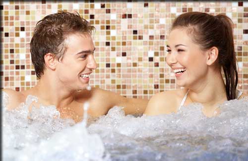 Couple enjoying the jacuzzi (whirlpool) in an Irish Spa